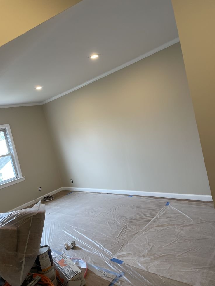 Plasterer applying a smooth finish to an interior wall